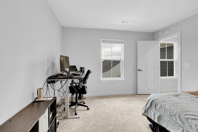 bedroom with light carpet, baseboards, and visible vents