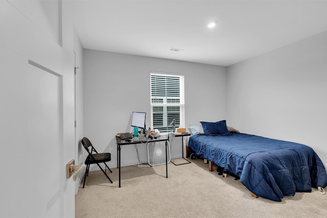 bedroom with light carpet and visible vents