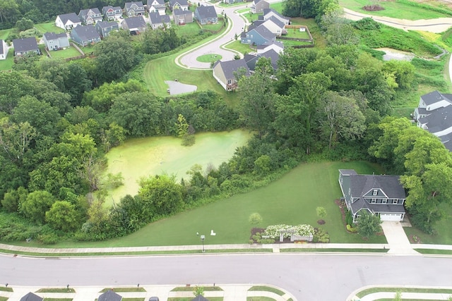 birds eye view of property with a residential view