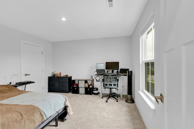 bedroom featuring carpet flooring and visible vents