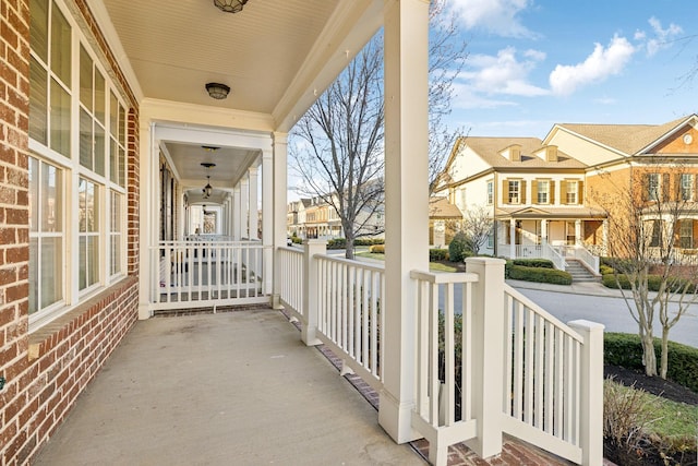 balcony with a residential view and covered porch