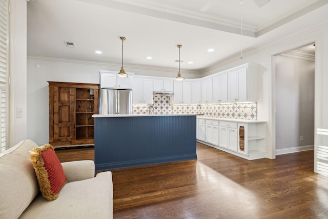 kitchen with dark wood-style floors, white cabinetry, crown molding, and freestanding refrigerator