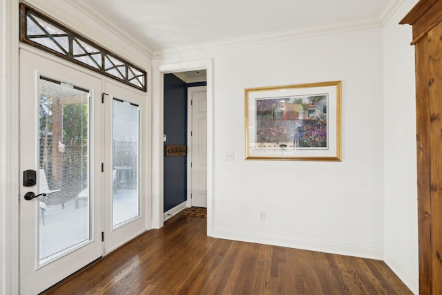 doorway to outside with dark wood-style floors, crown molding, and baseboards