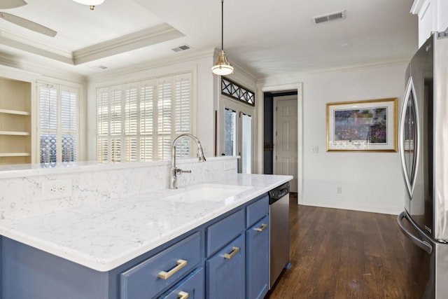 kitchen featuring blue cabinetry, visible vents, appliances with stainless steel finishes, and a sink