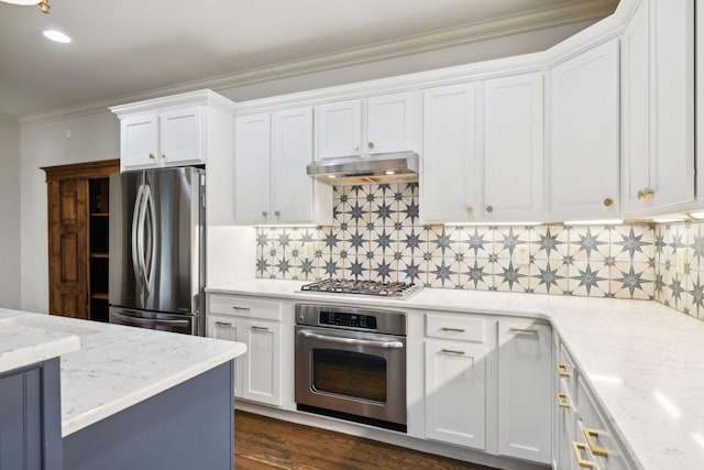 kitchen featuring under cabinet range hood, appliances with stainless steel finishes, white cabinets, and crown molding