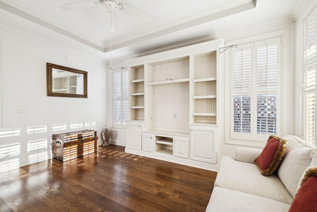 living room featuring dark wood-style floors, ceiling fan, a wealth of natural light, and crown molding