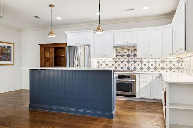 kitchen with under cabinet range hood, visible vents, white cabinets, ornamental molding, and appliances with stainless steel finishes