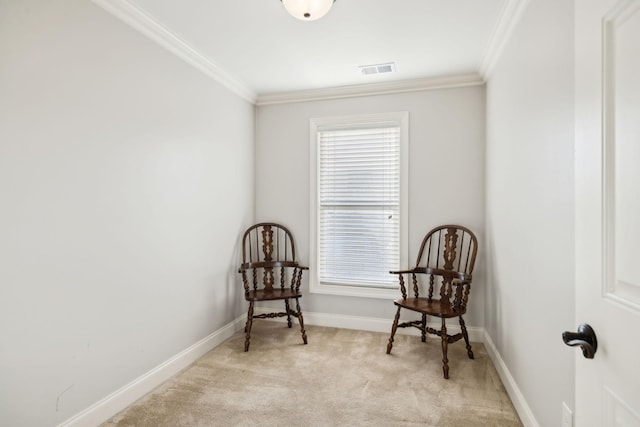 sitting room featuring light carpet, baseboards, visible vents, and crown molding