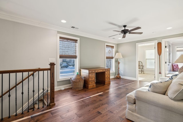 living room with ornamental molding, dark wood-style flooring, visible vents, and baseboards