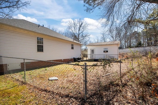 view of side of property featuring a fenced backyard