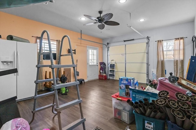 garage with white fridge with ice dispenser, recessed lighting, and a ceiling fan