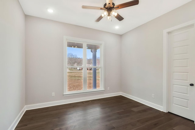 unfurnished room with ceiling fan, recessed lighting, dark wood finished floors, and baseboards