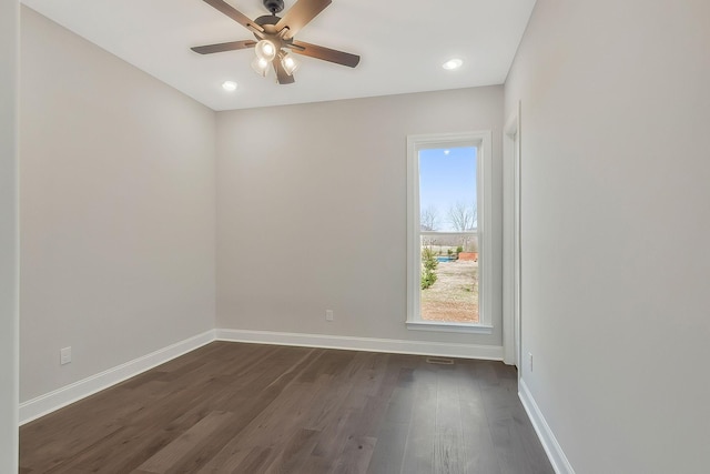 empty room with dark wood-style floors, ceiling fan, recessed lighting, and baseboards