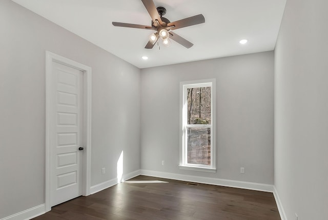 unfurnished room with dark wood-style floors, recessed lighting, baseboards, and a ceiling fan