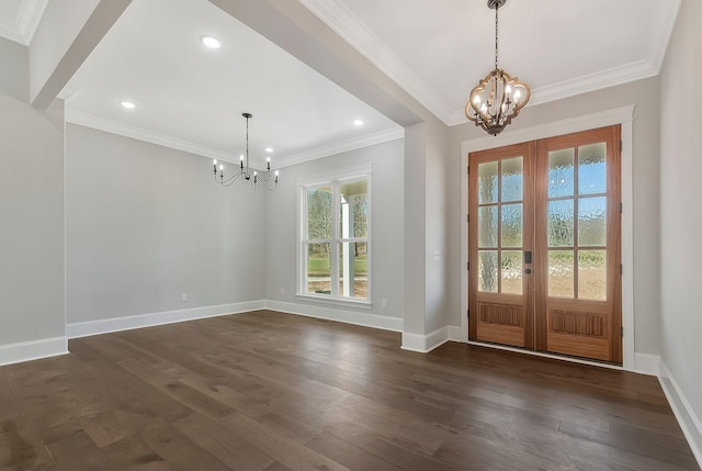 foyer featuring dark wood-style floors, a notable chandelier, french doors, and baseboards