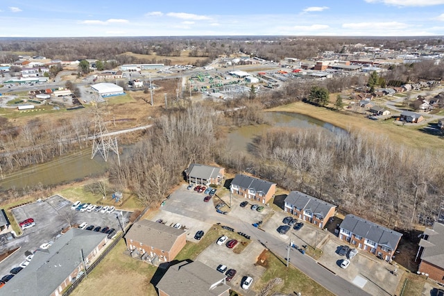 drone / aerial view featuring a water view and a residential view