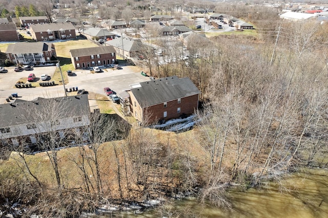 bird's eye view featuring a water view and a residential view