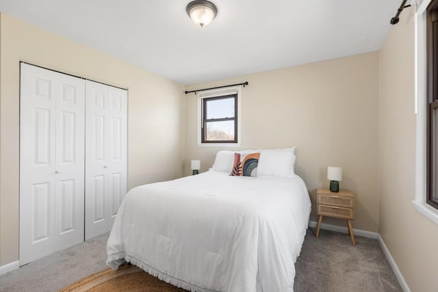 bedroom featuring carpet floors, a closet, and baseboards