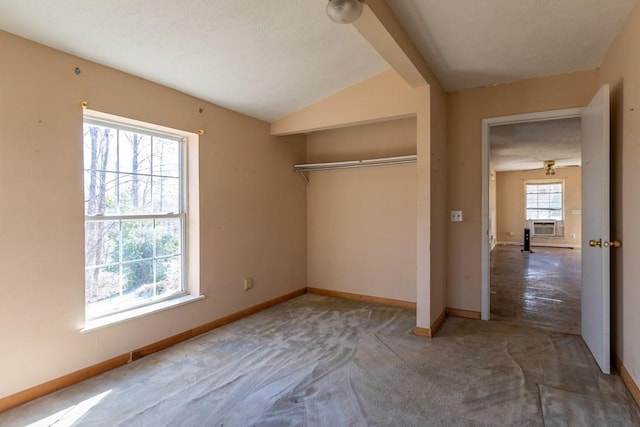 224 Golden Ln, Celina, TN 38551 - unfurnished bedroom with carpet floors, a closet, vaulted ceiling, cooling unit, and baseboards