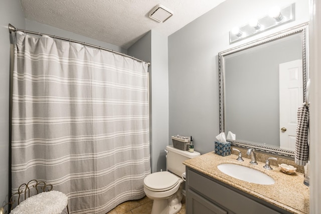 full bath with visible vents, toilet, a textured ceiling, vanity, and tile patterned floors