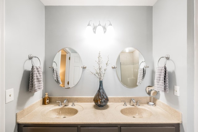 bathroom with double vanity and a sink