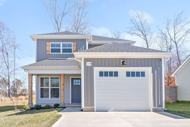 view of front of property with a garage, roof with shingles, and board and batten siding