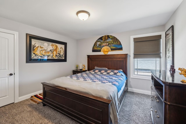 bedroom with baseboards and carpet flooring