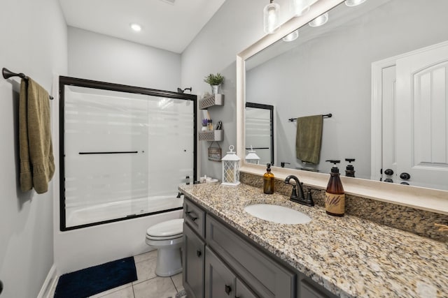 bathroom with tile patterned flooring, vanity, toilet, and bath / shower combo with glass door