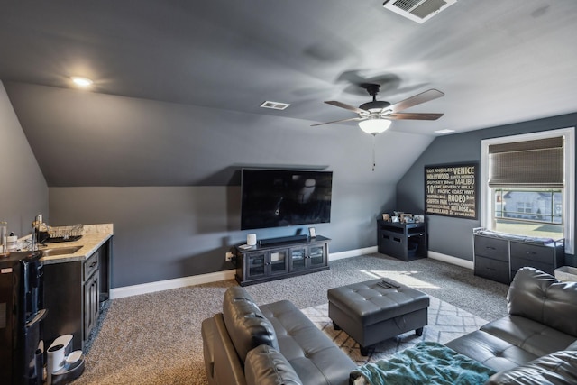 living room featuring vaulted ceiling, a ceiling fan, visible vents, and baseboards