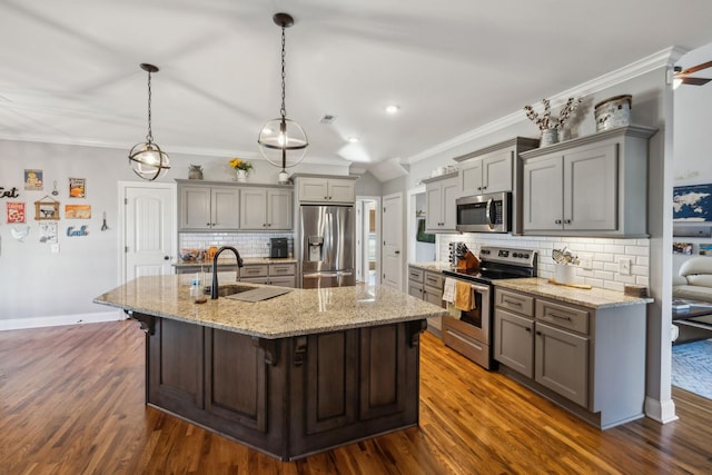 kitchen with ornamental molding, dark wood-type flooring, gray cabinets, stainless steel appliances, and a sink