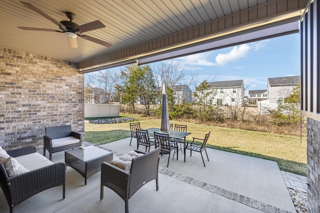 view of patio featuring outdoor dining space, ceiling fan, and an outdoor hangout area