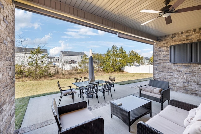 view of patio with a ceiling fan, outdoor dining area, outdoor lounge area, and fence