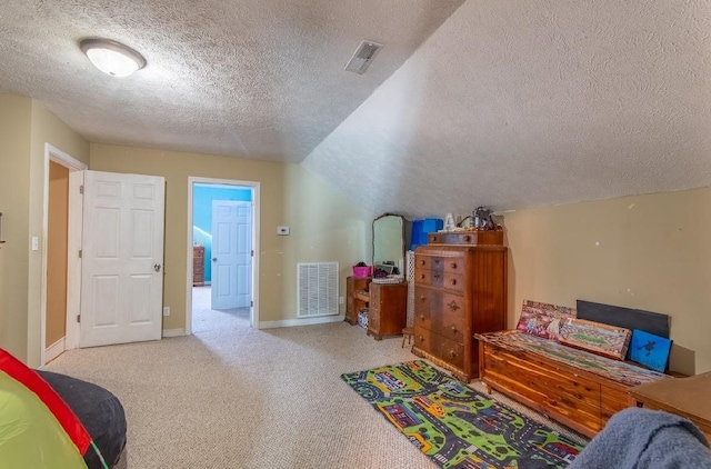 bedroom with vaulted ceiling, baseboards, visible vents, and light colored carpet