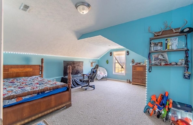 bedroom featuring carpet, visible vents, vaulted ceiling, and a textured ceiling