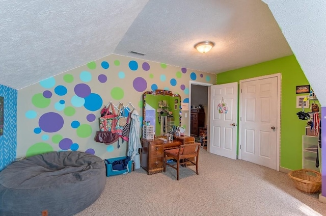 game room featuring carpet, lofted ceiling, visible vents, a textured ceiling, and wallpapered walls