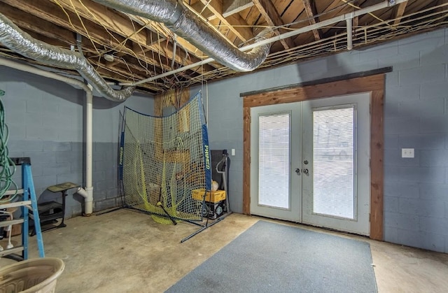 below grade area with concrete block wall and french doors