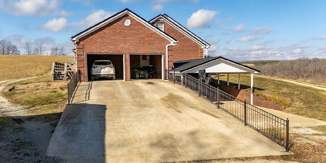 traditional-style home with a garage and brick siding