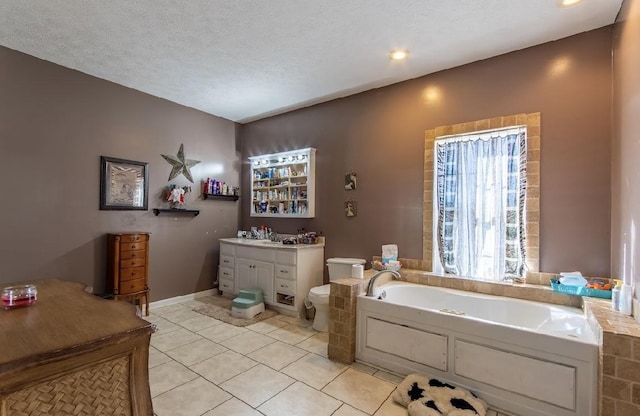 full bath with toilet, a garden tub, tile patterned flooring, and a textured ceiling