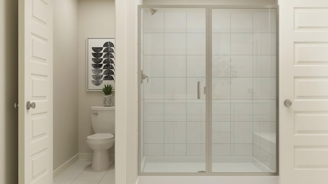 bathroom featuring toilet, a shower stall, and baseboards