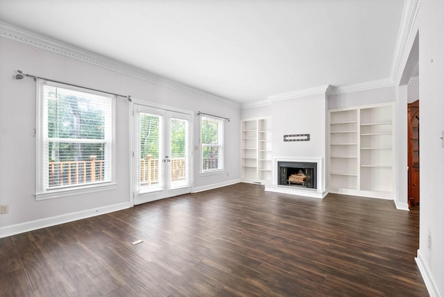 unfurnished living room with a fireplace with raised hearth, dark wood finished floors, and baseboards