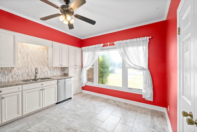 kitchen with visible vents, stainless steel dishwasher, white cabinetry, a sink, and light stone countertops