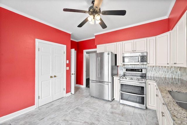 kitchen featuring light stone countertops, stainless steel appliances, white cabinetry, ornamental molding, and decorative backsplash