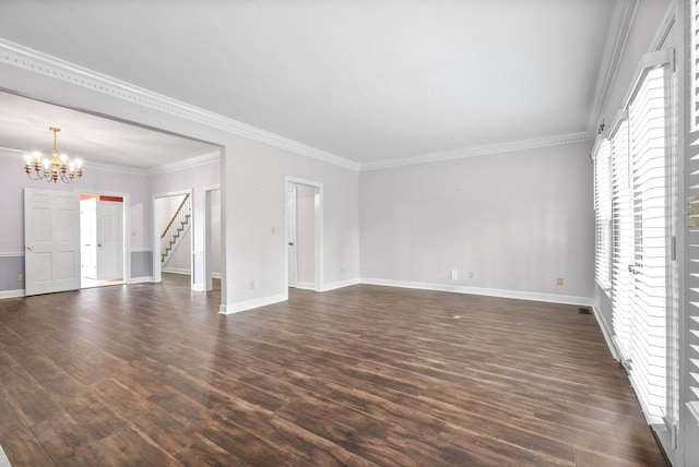 unfurnished living room with dark wood-style floors, ornamental molding, baseboards, and a notable chandelier