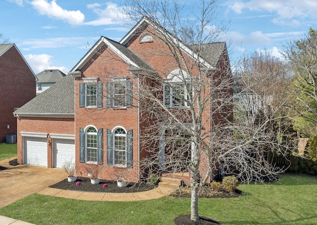 traditional-style house featuring brick siding, concrete driveway, a front yard, roof with shingles, and a garage