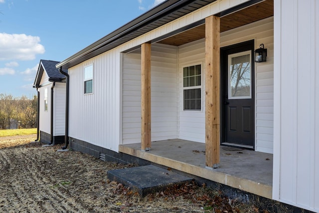 doorway to property featuring a porch