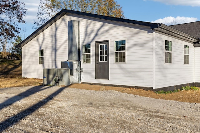 rear view of house featuring driveway