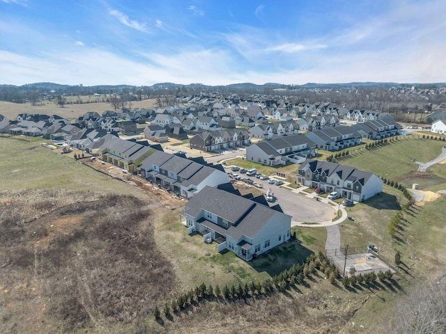 birds eye view of property with a residential view