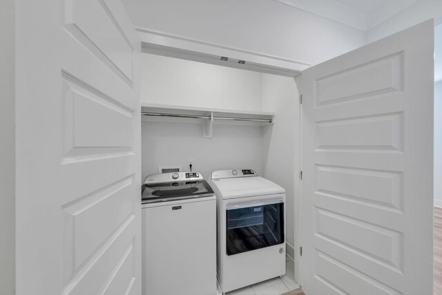 washroom with laundry area and washing machine and clothes dryer