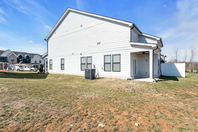 rear view of house featuring a patio, a yard, central air condition unit, ceiling fan, and fence