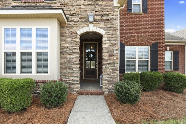 view of exterior entry with stone siding